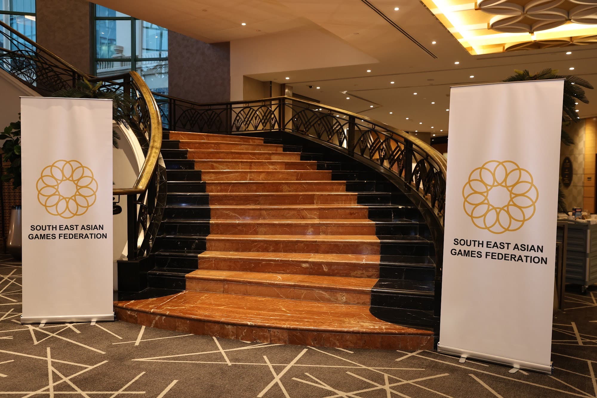 South East Asian Games Federation banners at the Sunway Resort Hotel staircase.