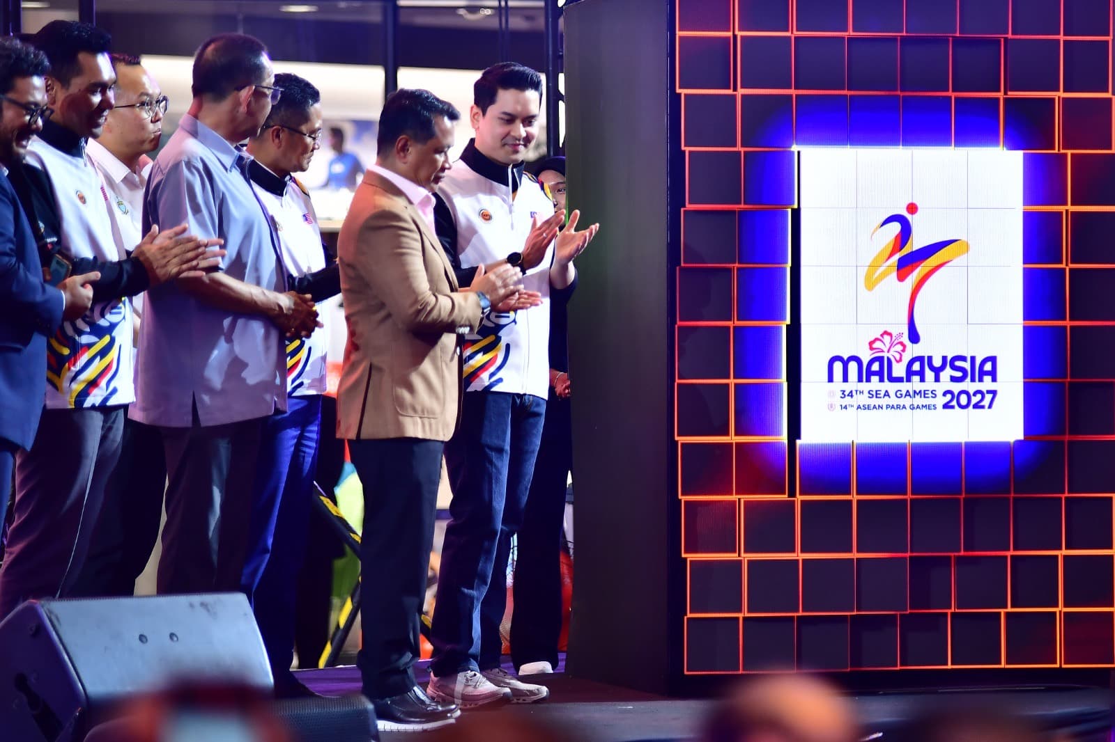 Applause as the official identity is unveiled.
