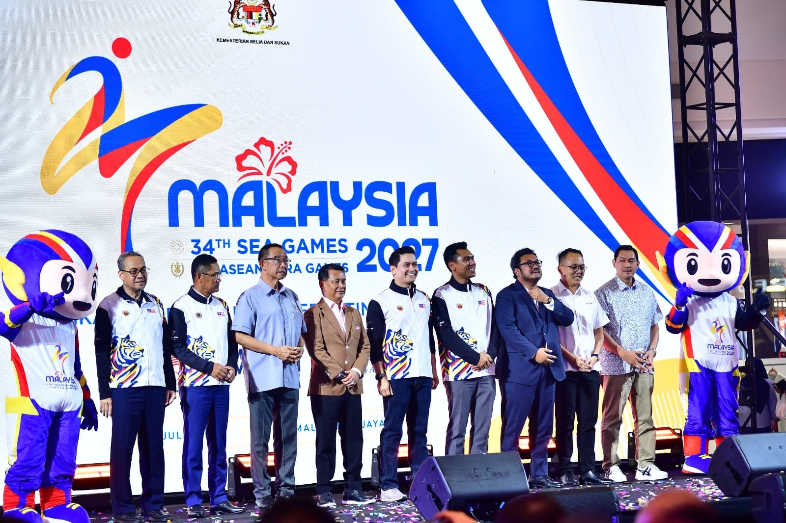 Officials with the two TUAH mascots after the launch.