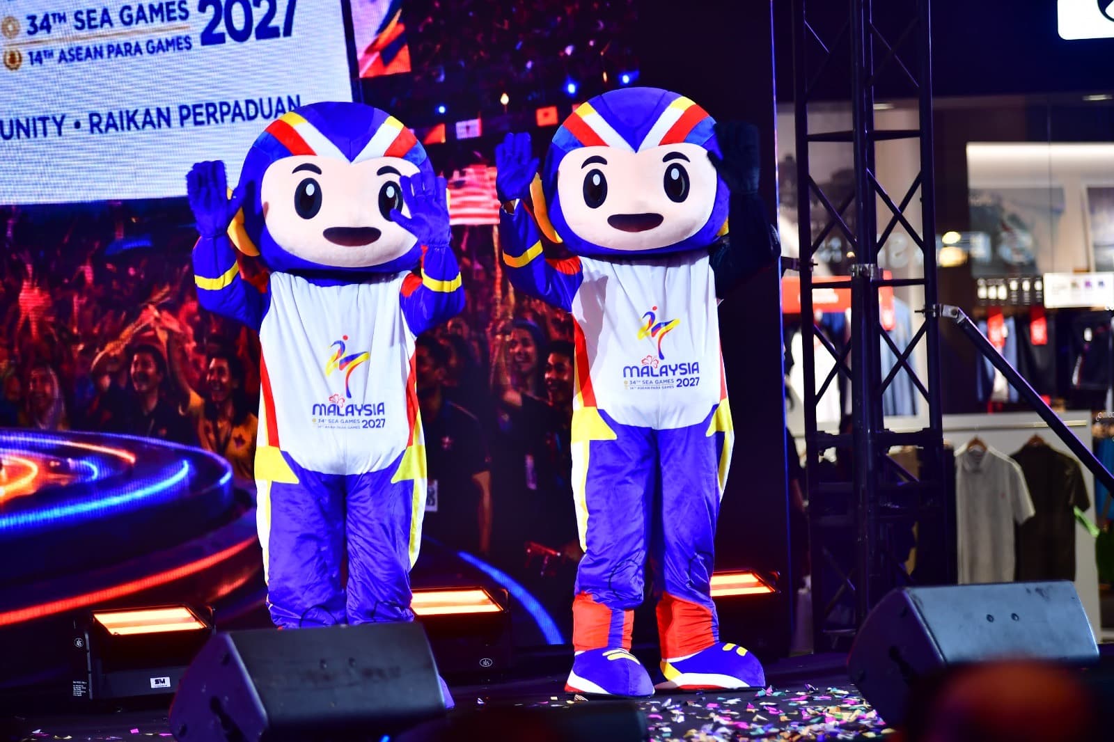 The two TUAH mascots waving to the audience.